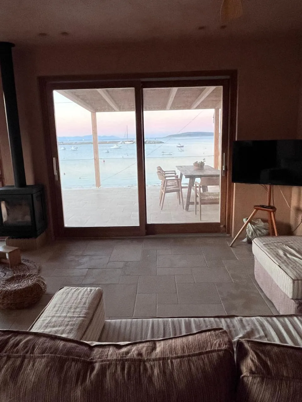 Living room sliding doors opening to the sea view terrace