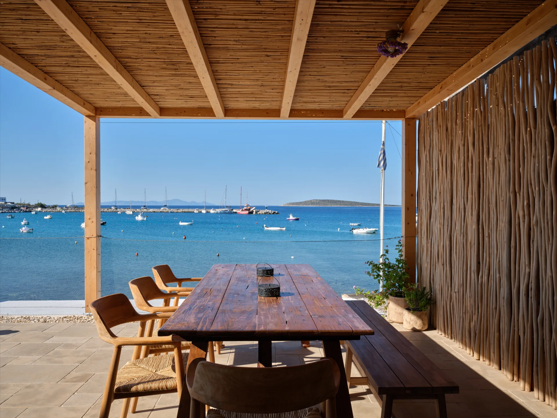 Covered balcony dining table with sea view