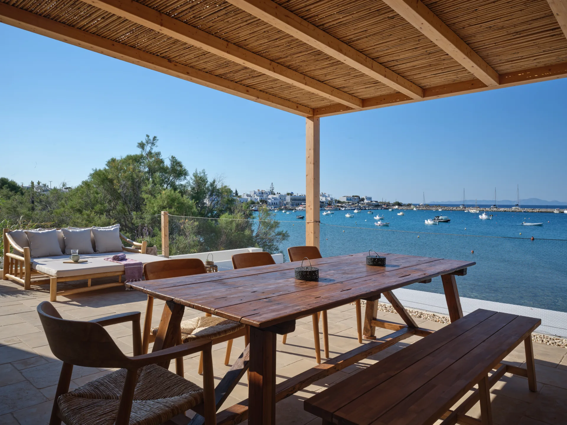 Balcony dining table overlooking Aliki harbor