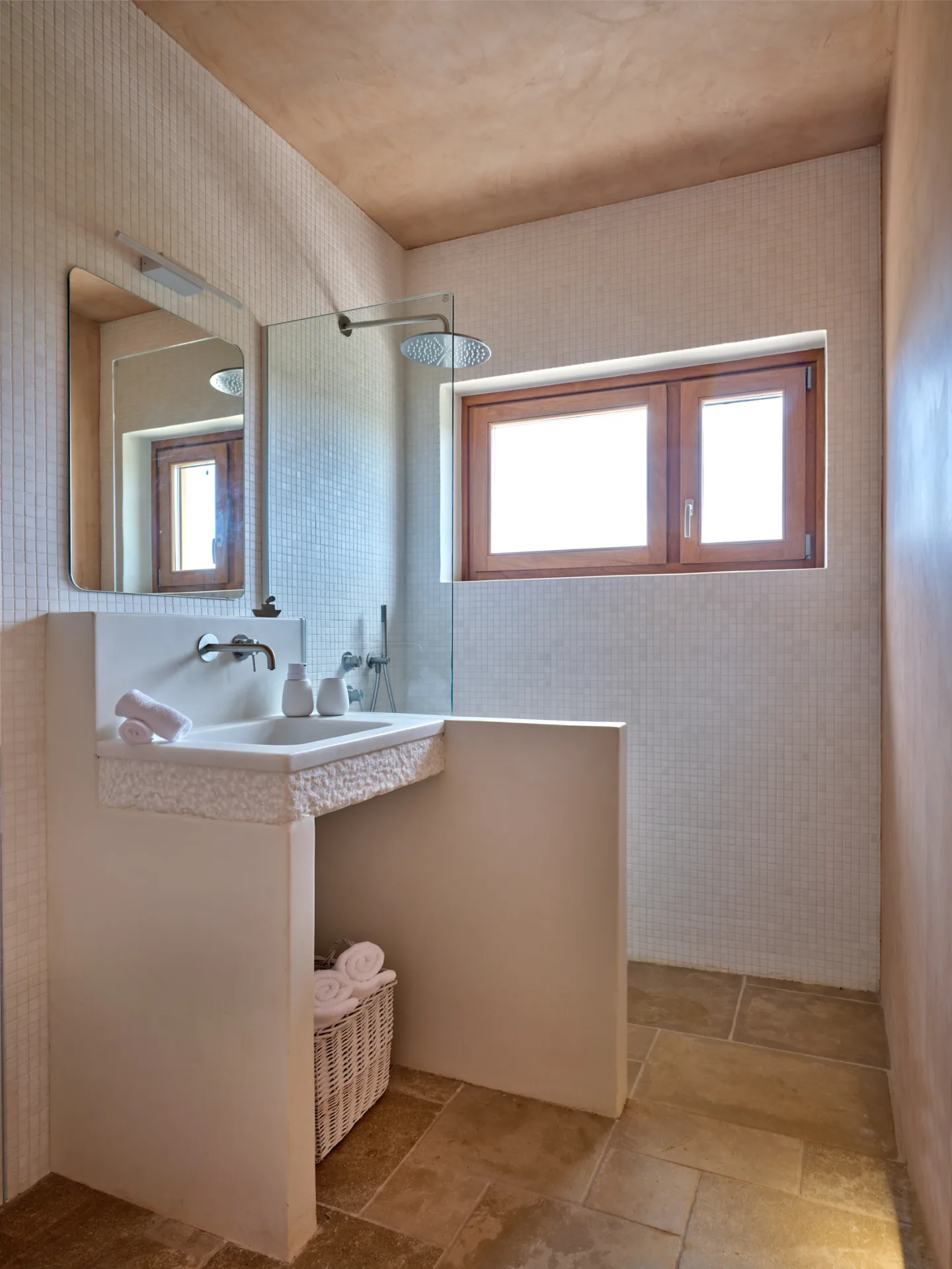 Bathroom with white mosaic vanity and shower