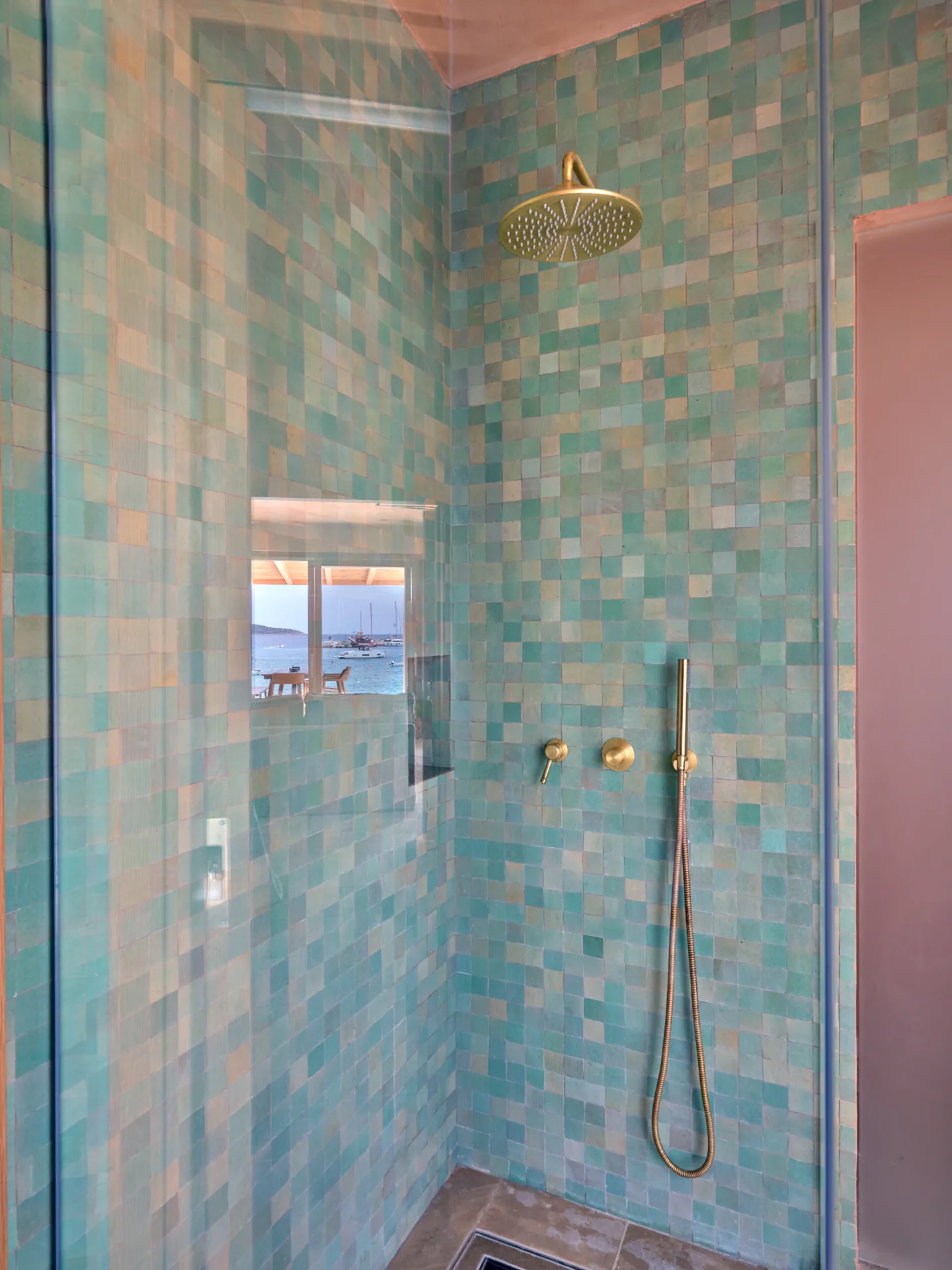 Bathroom with turquoise tile shower