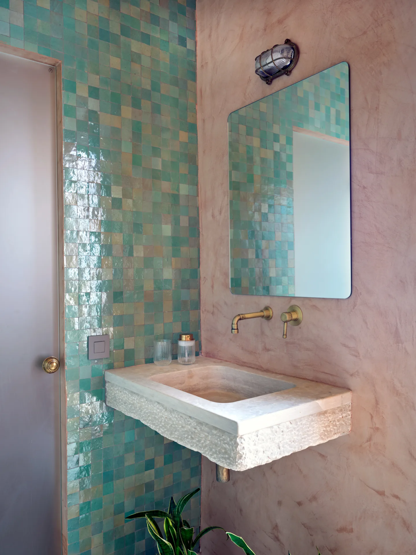 Bathroom with turquoise tile vanity