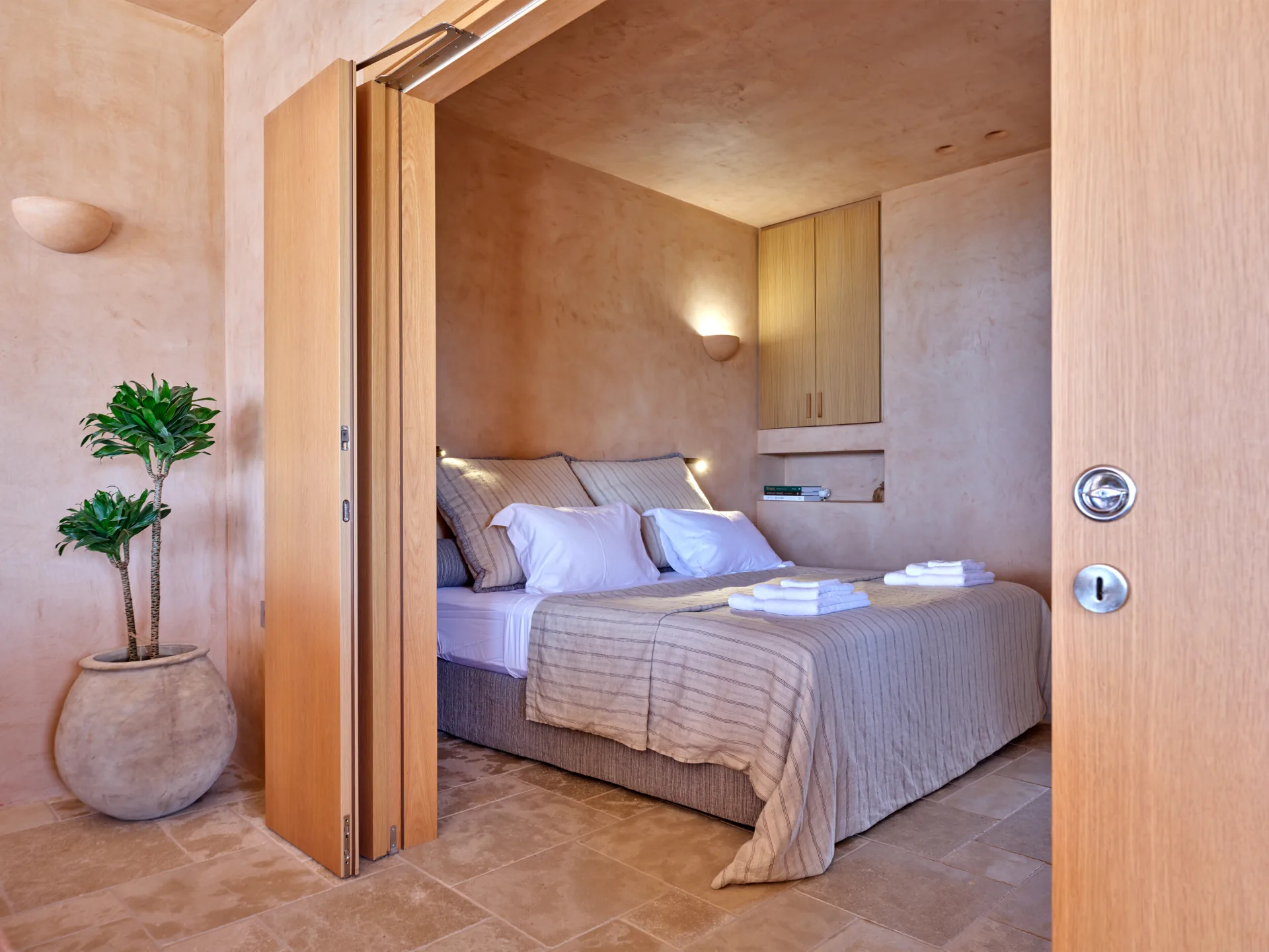 Bedroom seen through an open door