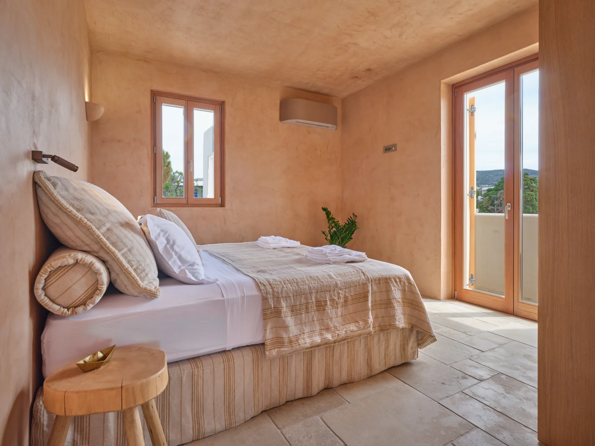 Bedroom with bed and balcony doors
