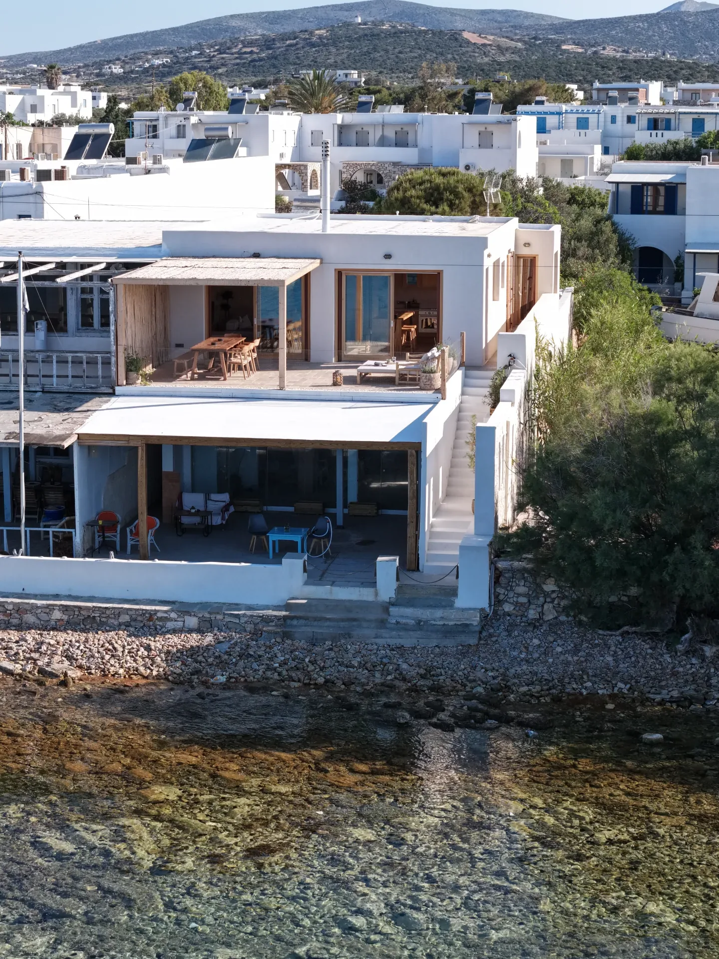 Side view of the house and stairs by the water