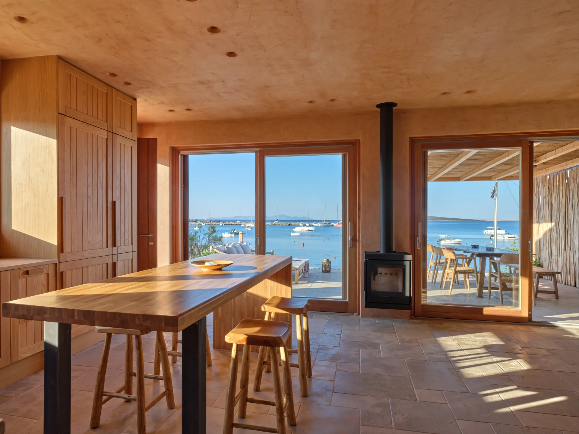 Kitchen island and living room with sea view