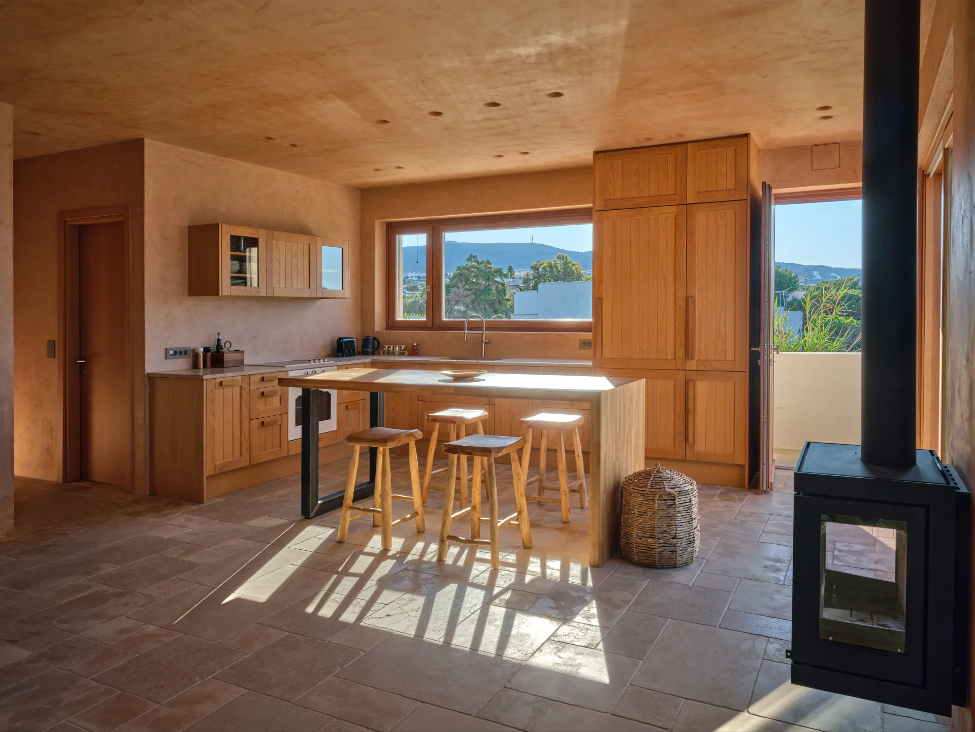 Kitchen island with doorway to the terrace