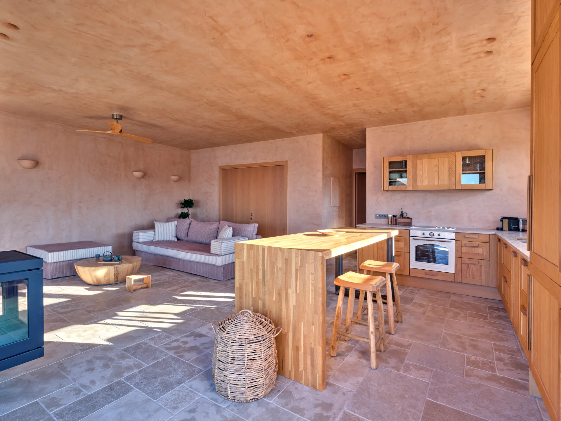 Open-plan living room with kitchen and sofa