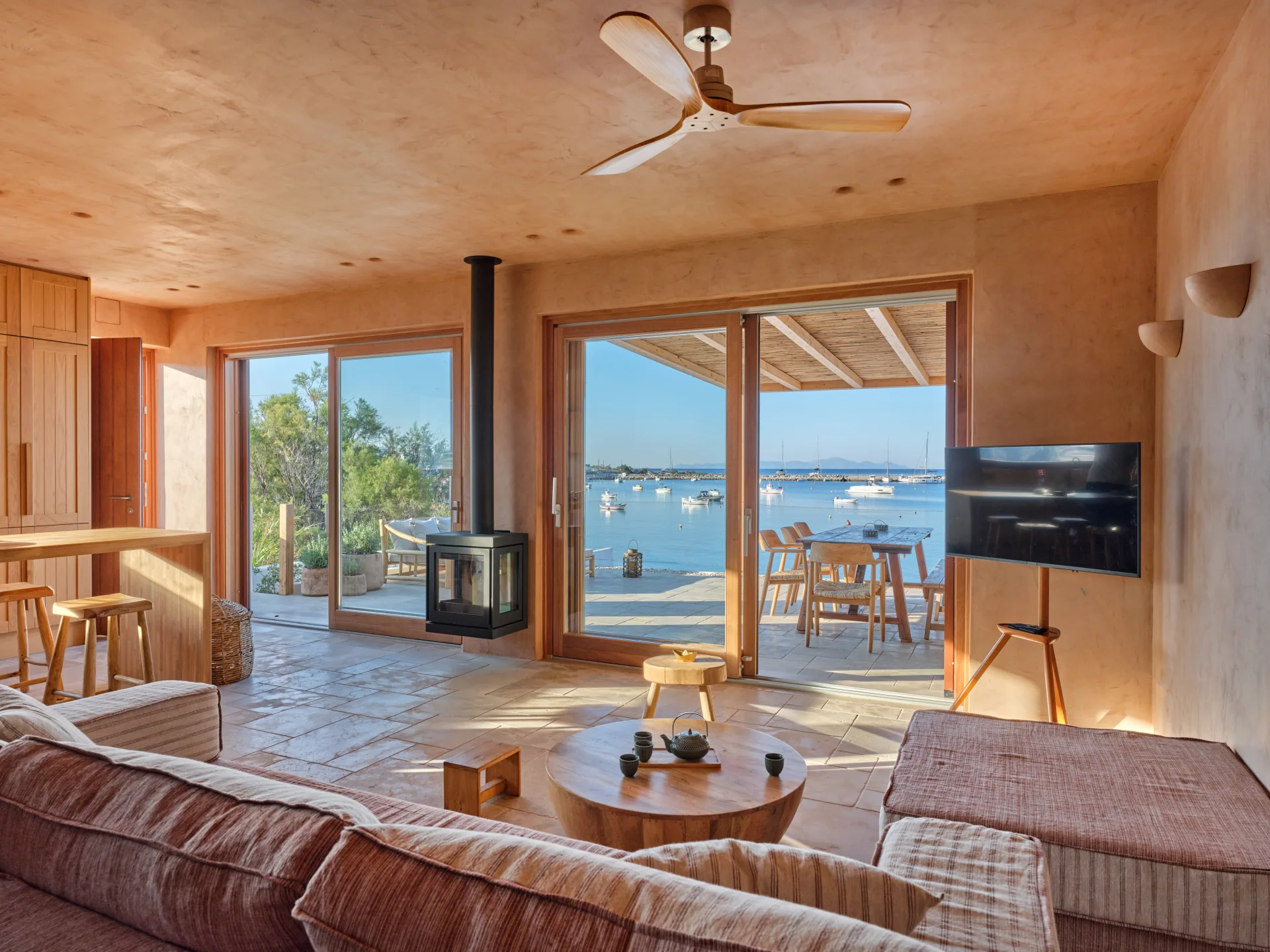 Living room sofas with fireplace and sea view