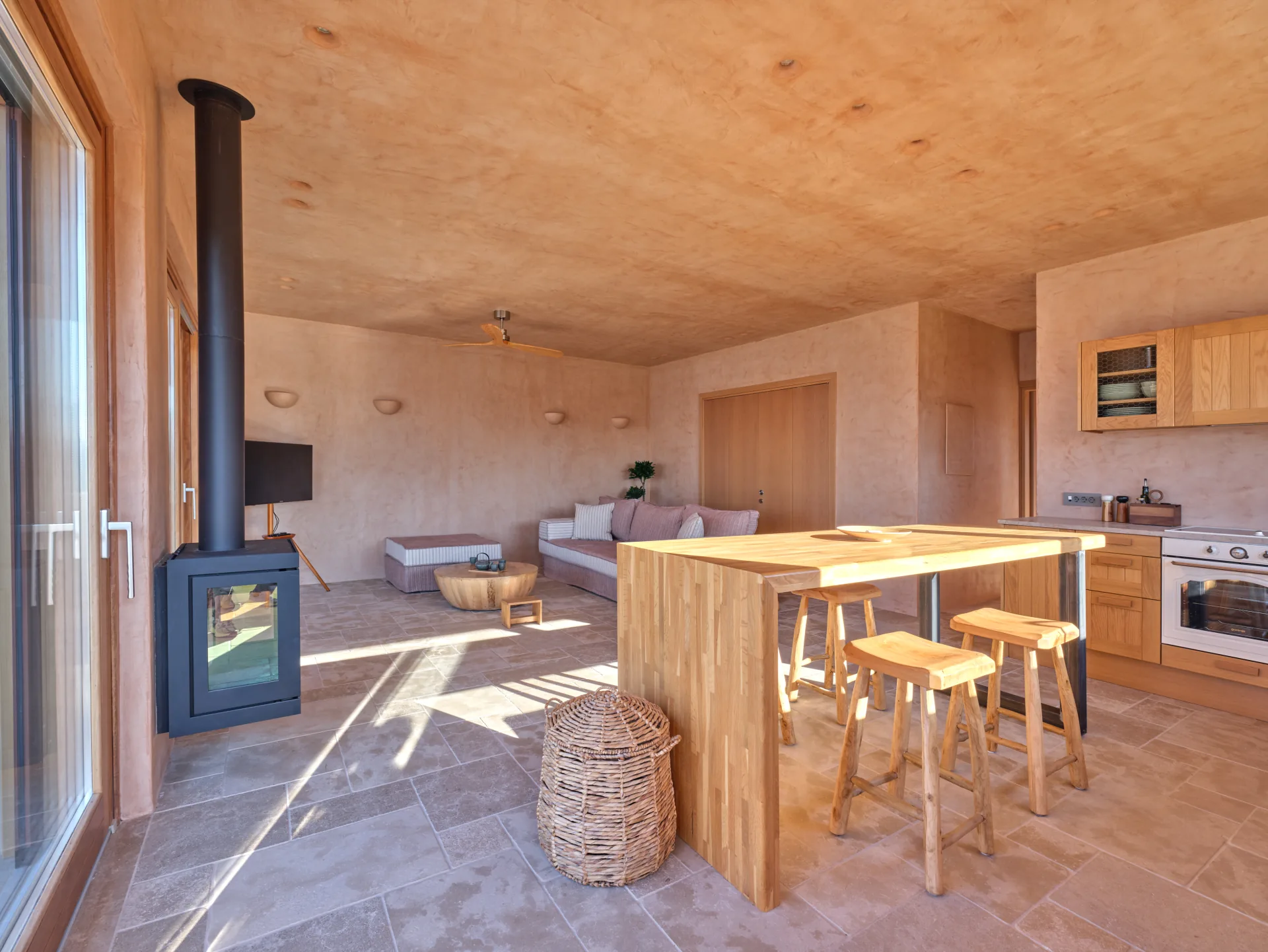 Wood stove and kitchen island in the living area